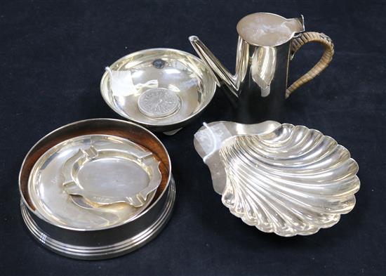 A modern silver wine coaster, two silver coin dishes, a fluted ashtray, a shell butter dish and a plated bachelor coffee pot
